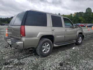 2000 Cadillac Escalade z VIN 1GYEK13R5YR112858, wystawiony jako Copart lot #71651294 z przebiegiem 228 689 mil mil oraz Szkody całkowita. Historia ofert i sprzedaży dostępna na DreamBid. Obrazek 3.