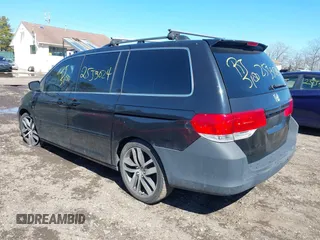 2009 Honda Odyssey EX-L with VIN 5FNRL38759B055396, listed as a IAAI auction lot 41863703 with 999,999 mi miles. Bid and sale history available at carsss.com. Image 3.