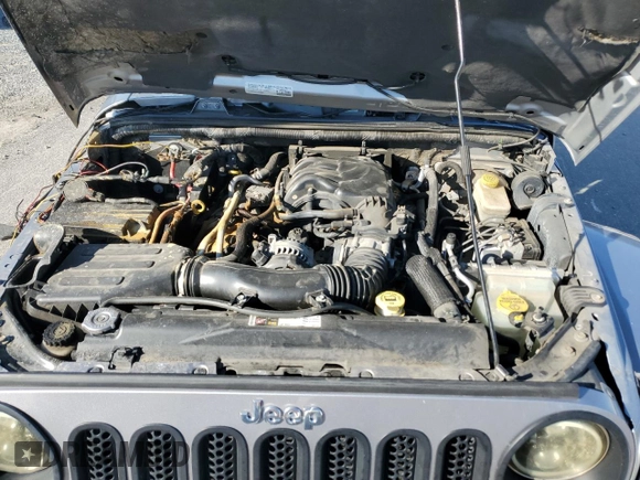 2015 Jeep Wrangler Unlimited Wrangler X with VIN 1C4BJWEG7FL580885, listed as a Copart auction lot 48891605 with 104,448 mi miles and Salvage title. Bid and sale history available at DreamBid. Image 11.