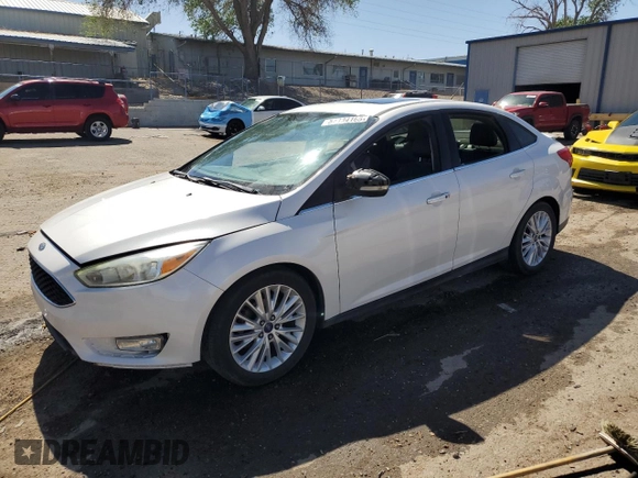 2015 Ford Focus Titanium with VIN 1FADP3J23FL300126, listed as a Copart auction lot 54434165 with 176,526 mi miles and Salvage title. Bid and sale history available at DreamBid. Image 1.