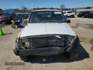 1995 Jeep Cherokee Sport with VIN 1J4FJ68S0SL646747, listed as a Copart auction lot 48772675 with 239,834 mi miles and Salvage title. Bid and sale history available at DreamBid. Image 5.