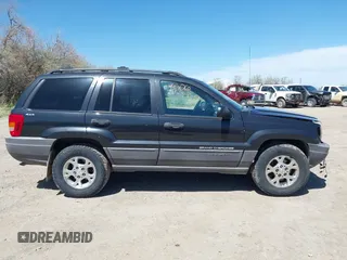1999 Jeep Grand Cherokee Laredo with VIN 1J4GW58S8XC524502, listed as a IAAI auction lot 42193506 with 147,920 mi miles and . Bid and sale history available at DreamBid. Image 14.