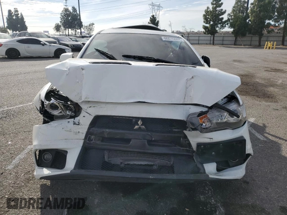 2014 Mitsubishi Lancer Evolution GSR z VIN JA32W8FV2EU019253, wystawiony jako Copart lot #86615084 z przebiegiem 104 894 mil mil oraz Szkody całkowita. Historia ofert i sprzedaży dostępna na DreamBid. Obrazek 5.