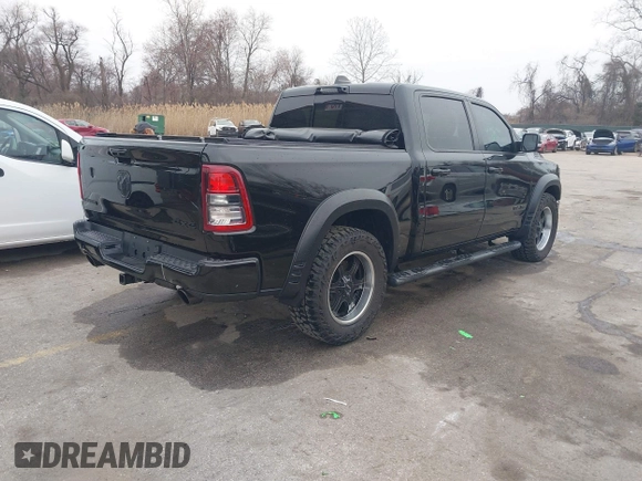 2022 Ram 1500 Big Horn with VIN 1C6SRFFT3NN287385, listed as a IAAI auction lot 41793596 with 12,277 mi miles and . Bid and sale history available at DreamBid. Image 4.