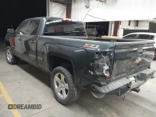 2017 Chevrolet Silverado 1500 LT with VIN 1GCUKREC4HF179560, listed as a IAAI auction lot 41460202 with 136,675 mi miles and . Bid and sale history available at DreamBid. Image 3.