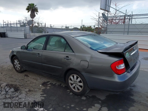 2004 Toyota Camry LE with VIN 4T1BF32K84U588764, listed as a IAAI auction lot 42126345 with 144,642 mi miles. Bid and sale history available at carsss.com. Image 3.