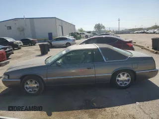 1998 Cadillac Eldorado z VIN 1G6EL12YXWU610918, wystawiony jako Copart lot #57309075 z przebiegiem 168 228 mil mil oraz Szkoda całkowita • Salvage title. Historia ofert i sprzedaży dostępna na DreamBid. Obrazek 1.