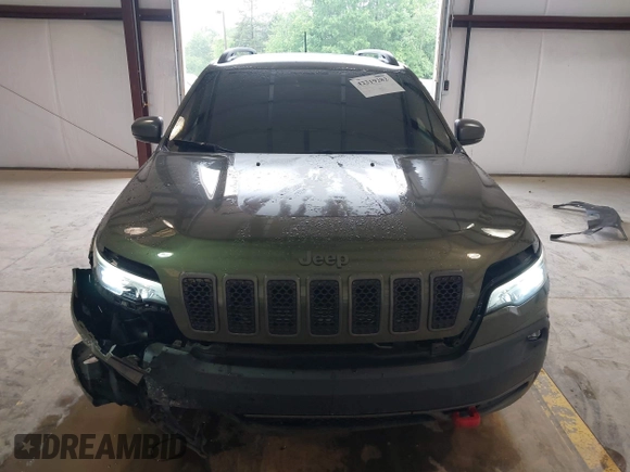 2020 Jeep Cherokee Trailhawk Elite with VIN 1C4PJMBN2LD538076, listed as a IAAI auction lot 42219282 with 53,773 mi miles and . Bid and sale history available at DreamBid. Image 12.