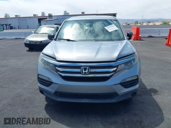 2016 Honda Pilot LX with VIN 5FNYF5H10GB044006, listed as a IAAI auction lot 42075404 with 129,642 mi miles and . Bid and sale history available at DreamBid. Image 12.
