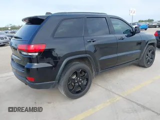 2018 Jeep Grand Cherokee Altitude with VIN 1C4RJFAG9JC436848, listed as a IAAI auction lot 42303459 with 124,044 mi miles and . Bid and sale history available at DreamBid. Image 4.
