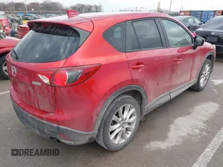 2015 Mazda CX-5 Grand Touring with VIN JM3KE4DY1F0540586, listed as a IAAI auction lot 41710216 with 148,800 mi miles. Bid and sale history available at carsss.com. Image 4.