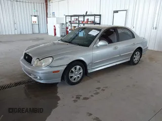 2002 Hyundai Sonata GLS with VIN KMHWF35H32A643718, listed as a IAAI auction lot 41668672 with 174,782 mi miles. Bid and sale history available at carsss.com. Image 2.