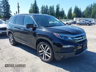 2016 Honda Pilot Touring with VIN 5FNYF6H95GB123568, listed as a IAAI auction lot 42639849 with 156,762 mi miles and . Bid and sale history available at DreamBid. Image 1.