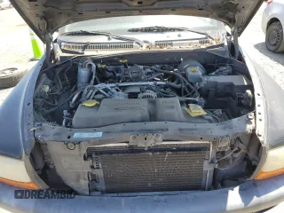 2001 Dodge Dakota Sport z VIN 1B7HG2AN61S316996, wystawiony jako Copart lot #58677535 z przebiegiem 164 628 mil mil oraz Tytuł czysty. Historia ofert i sprzedaży dostępna na DreamBid. Obrazek 11.