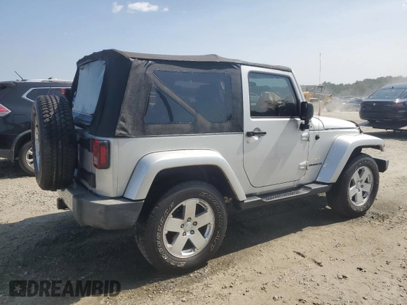 2009 Jeep Wrangler Sahara with VIN 1J4FA54119L747068, listed as a Copart auction lot 71209904 with 86,978 mi miles and Salvage title. Bid and sale history available at DreamBid. Image 3.