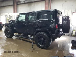 2015 Jeep Wrangler Unlimited Rubicon Hard Rock with VIN 1C4HJWFG4FL676868, listed as a Copart auction lot 48489525 with 100,771 mi miles and Salvage title. Bid and sale history available at DreamBid. Image 2.