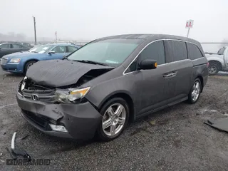 2012 Honda Odyssey Touring with VIN 5FNRL5H99CB045992, listed as a IAAI auction lot 41568183 with 133,304 mi miles. Bid and sale history available at carsss.com. Image 2.