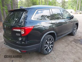 2019 Honda Pilot Touring 7-Passenger with VIN 5FNYF6H60KB030990, listed as a IAAI auction lot 42160762 with 68,807 mi miles and . Bid and sale history available at DreamBid. Image 4.