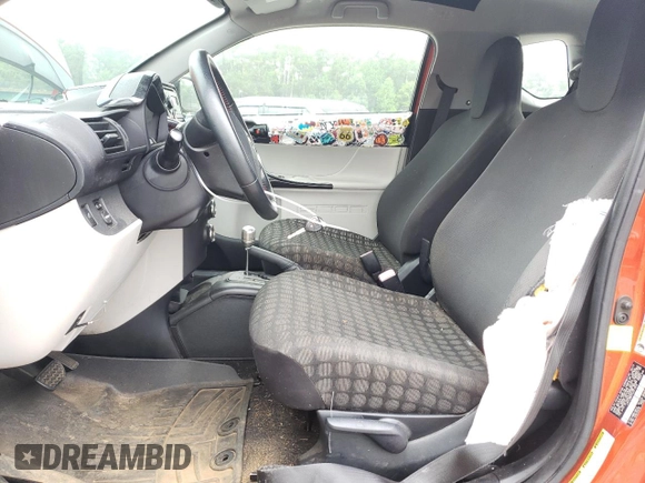 2012 Scion iQ with VIN JTNJJXB07CJ017816, listed as a Copart auction lot 59616355 with 141,384 mi miles and Salvage title. Bid and sale history available at DreamBid. Image 7.