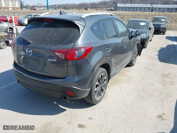 2016 Mazda CX-5 Grand Touring with VIN JM3KE4DY5G0837958, listed as a IAAI auction lot 41713313 with NaN miles. Bid and sale history available at carsss.com. Image 4.