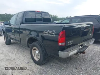 2000 Ford F-150 XL with VIN 1FTRX18LXYNB58643, listed as a IAAI auction lot 42100553 with 382,492 mi miles. Bid and sale history available at carsss.com. Image 3.
