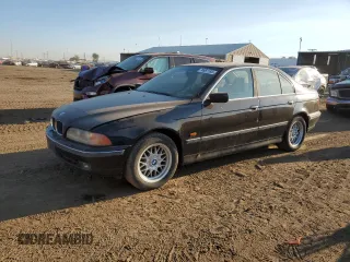 1999 BMW 5 Series 528iA with VIN WBADM634XXGU02243, listed as a Copart auction lot 74981184 with 234,566 mi miles and Salvage Title. Bid and sale history available at carsss.com. Image 1.