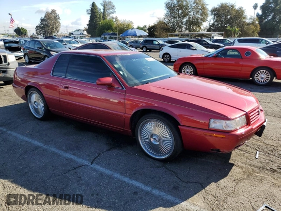 1999 Cadillac Eldorado Touring z VIN 1G6ET1293XU611368, wystawiony jako Copart lot #82683114 z przebiegiem 126 178 mil mil oraz Szkody całkowita. Historia ofert i sprzedaży dostępna na DreamBid. Obrazek 4.