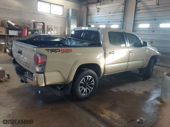 2020 Toyota Tacoma 4WD SR5 with VIN 3TMCZ5AN1LM318866, listed as a IAAI auction lot 41619290 with 69,973 mi miles. Bid and sale history available at carsss.com. Image 4.