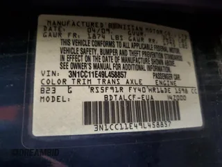 2009 Nissan Versa 1.6 z VIN 3N1CC11E49L458857, wystawiony jako Copart lot #59195275 z przebiegiem 100 351 mil mil oraz Szkoda całkowita • Salvage title. Historia ofert i sprzedaży dostępna na DreamBid. Obrazek 13.