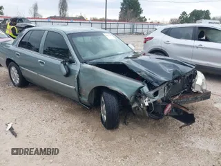 2005 Mercury Grand Marquis LS Premium z VIN 2MEHM75W45X662040, wystawiony jako IAAI lot #41697234 z przebiegiem 214 410 mil mil oraz . Historia ofert i sprzedaży dostępna na DreamBid. Obrazek 1.
