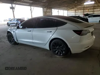 2021 Tesla Model 3 Long Range with VIN 5YJ3E1EB4MF938427, listed as a Copart auction lot 88270665 with 67,246 mi miles and Salvage Title. Bid and sale history available at carsss.com. Image 2.