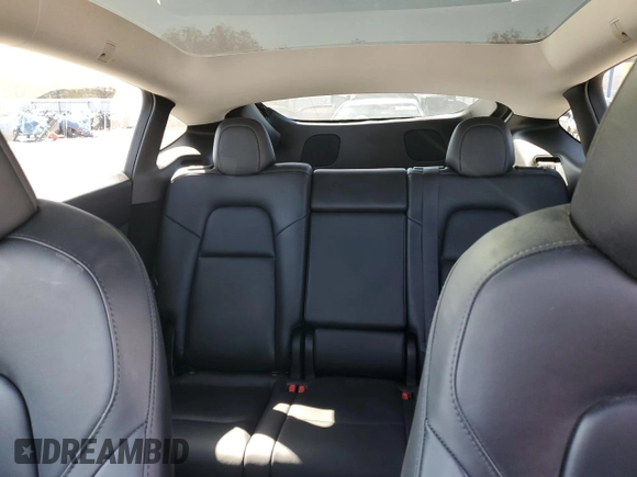 2023 Tesla Model Y Performance with VIN 7SAYGDEF7PF924355, listed as a Copart auction lot 47877055 with 64,663 mi miles and Salvage Title. Bid and sale history available at DreamBid. Image 10.