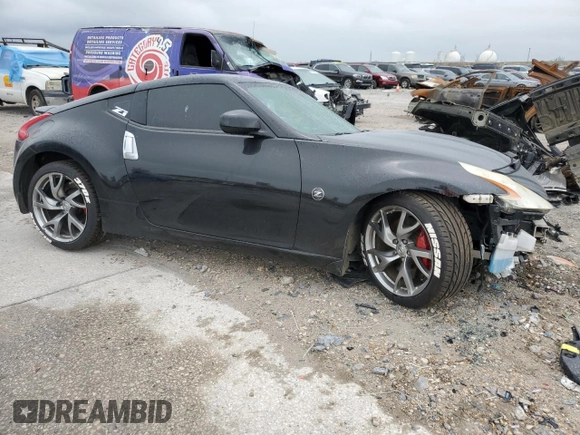 2014 Nissan 370Z Nismo z VIN JN1AZ4EH0EM634461, wystawiony jako Copart lot #53375685 z przebiegiem 171 858 mil mil oraz Szkoda całkowita • Salvage title. Historia ofert i sprzedaży dostępna na DreamBid. Obrazek 4.