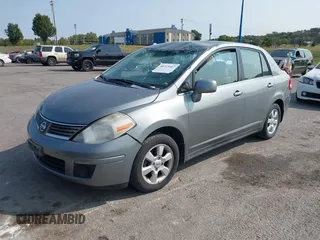 2007 Nissan Versa SL with VIN 3N1BC11E47L404371, listed as a IAAI auction lot 40309667 with 131,954 mi miles and . Bid and sale history available at DreamBid. Image 2.