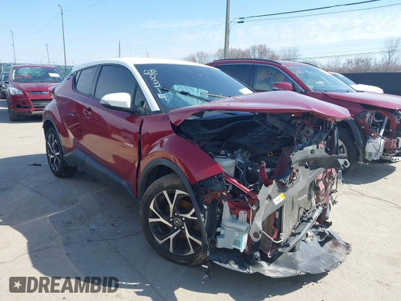 2018 Toyota C-HR XLE with VIN NMTKHMBX2JR012246, listed as a IAAI auction lot 41735772 with 124,467 mi miles. Bid and sale history available at carsss.com. Image 1.
