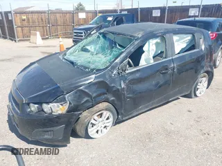 2012 Chevrolet Sonic LT with VIN 1G1JC6SB9C4200197, listed as a IAAI auction lot 42085421 with 124,667 mi miles. Bid and sale history available at carsss.com. Image 2.