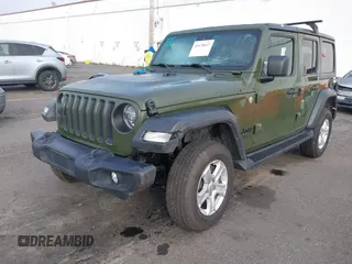 2021 Jeep Wrangler Unlimited Willys with VIN 1C4HJXDM1MW812674, listed as a IAAI auction lot 41670637 with 59,241 mi miles and . Bid and sale history available at DreamBid. Image 2.