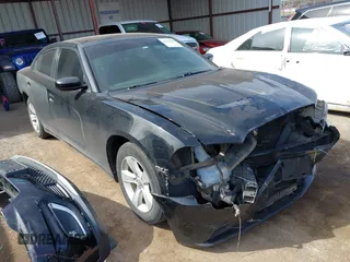2014 Dodge Charger SE with VIN 2C3CDXBG8EH267589, listed as a IAAI auction lot 41793004 with 154,771 mi miles and . Bid and sale history available at DreamBid. Image 1.