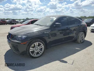2014 BMW X6 M with VIN 5YMGZ0C53E0C40737, listed as a Copart auction lot 72794934 with 64,936 mi miles and Salvage Title. Bid and sale history available at carsss.com. Image 1.