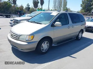 2001 Toyota Sienna LE with VIN 4T3ZF13C21U397063, listed as a IAAI auction lot 42033574 with 219,783 mi miles. Bid and sale history available at carsss.com. Image 2.