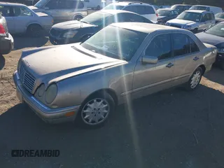1996 Mercedes-Benz E-Class with VIN WDBJF55F2TJ005257, listed as a IAAI auction lot 40588819 with 999,999 mi miles. Bid and sale history available at carsss.com. Image 2.
