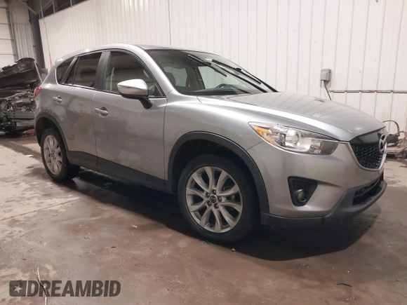 2015 Mazda CX-5 Grand Touring with VIN JM3KE4DY2F0477966, listed as a IAAI auction lot 41247178 with 116,582 mi miles. Bid and sale history available at carsss.com. Image 1.