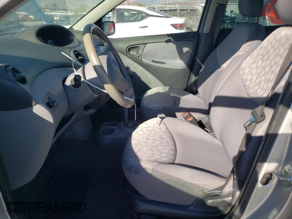 2002 Toyota ECHO with VIN JTDBT123025027203, listed as a Copart auction lot 70723424 with 187,299 mi miles and Salvage Title. Bid and sale history available at DreamBid. Image 7.