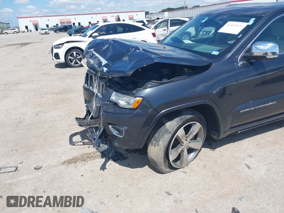 2015 Jeep Grand Cherokee High Altitude with VIN 1C4RJFCG5FC807394, listed as a IAAI auction lot 42452034 with 72,011 mi miles and . Bid and sale history available at DreamBid. Image 6.