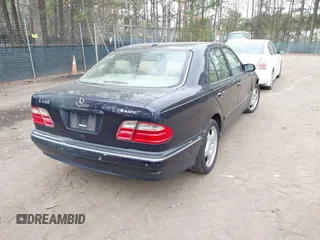 2002 Mercedes-Benz E-Class AWD with VIN WDBJF83J32X068355, listed as a IAAI auction lot 41872613 with 143,501 mi miles. Bid and sale history available at carsss.com. Image 4.