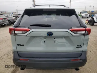 2021 Toyota RAV4 Hybrid XLE with VIN 2T3RWRFV8MW116853, listed as a Copart auction lot 65974935 with 89,319 mi miles and Salvage title. Bid and sale history available at DreamBid. Image 6.