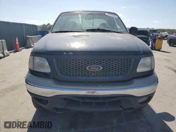 2000 Ford F-150 XL with VIN 1FTRX18L0YNB65908, listed as a Copart auction lot 54797585 with 298,924 mi miles and Clean title. Bid and sale history available at DreamBid. Image 5.