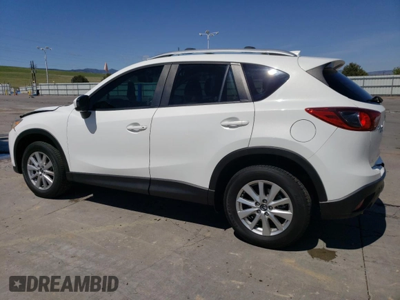 2014 Mazda CX-5 Touring z VIN JM3KE4CYXE0393443, wystawiony jako Copart lot #54738705 z przebiegiem 68 220 mil mil oraz Szkody całkowita. Historia ofert i sprzedaży dostępna na DreamBid. Obrazek 2.