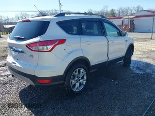 2013 Ford Escape SEL with VIN 1FMCU9HX1DUB37918, listed as a IAAI auction lot 41644931 with 153,726 mi miles and . Bid and sale history available at DreamBid. Image 4.