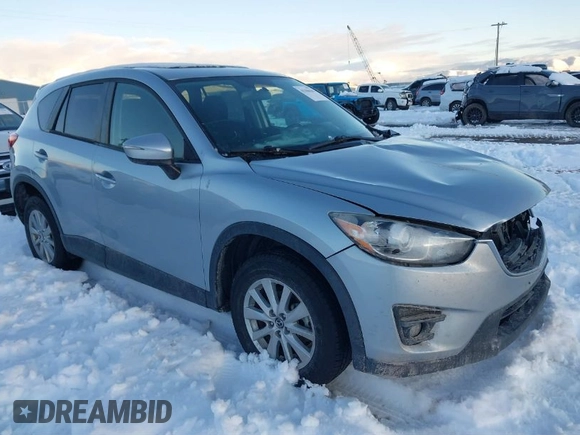 2016 Mazda CX-5 Touring with VIN JM3KE4CY9G0904000, listed as a IAAI auction lot 41186630 with 73,900 mi miles. Bid and sale history available at carsss.com. Image 1.